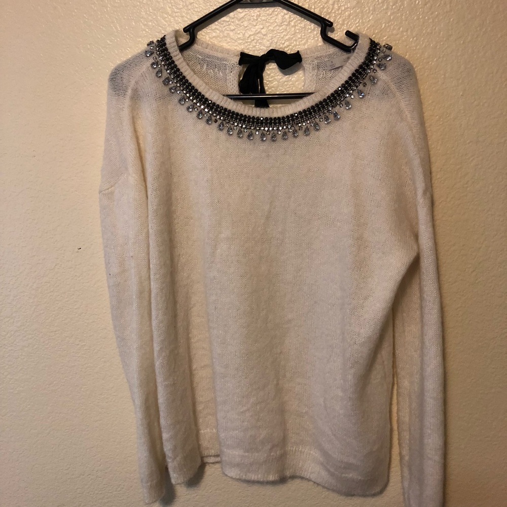 Cream fuzzy sweater with embellished neckline